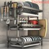 A Carbon Steel Dish Rack with Two Or Three Tiers, Featuring a Drainboard, Utensil Holder, And Hooks for Cups. This Space-Efficient Organizer for Kitchen Countertops Comes in Black, Requires No Electricity, And Has a Smooth End